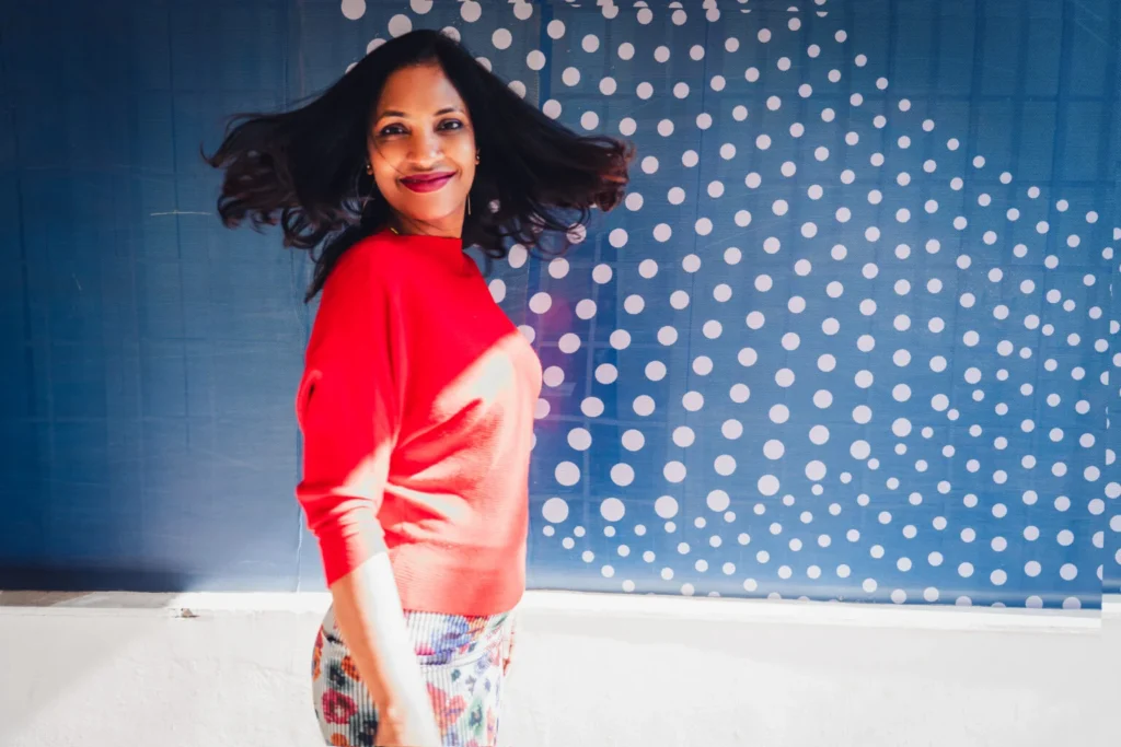 Playful hair flip photo poses for women in casual outfit