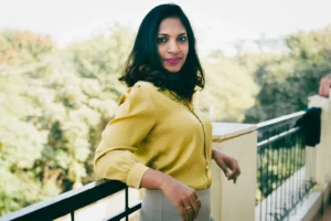 Side pose of Confident Business women leaning against railing